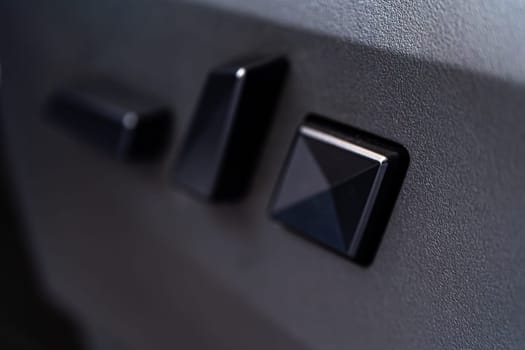 Denver, Colorado, USA-May 5, 2024-This image captures a close-up view of the seat adjustment buttons located in the Tesla Cybertruck, emphasizing the minimalist and sleek design of the vehicle interior controls.