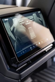 Denver, Colorado, USA-May 5, 2024-This image captures the sophisticated rear seat screen interface in the Tesla Cybertruck, highlighting the vehicle cutting-edge technology and user-friendly features, offering passengers control and comfort during their journey.