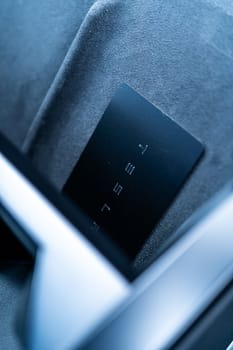 Denver, Colorado, USA-May 5, 2024-his image captures the sleek Tesla Cybertruck key card positioned neatly in the vehicle card holder, highlighting its minimalist design and emphasizing the modern aesthetic of Tesla innovative features.