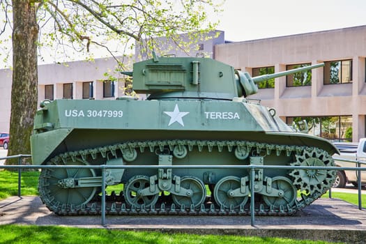 Vintage TERESA military tank displayed in Warsaw, Indiana, symbolizing strength and history.