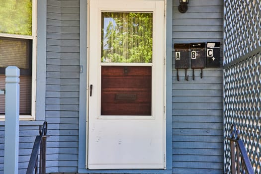 Charming entrance of a historic home in Fort Wayne, reflecting community and serene urban life.