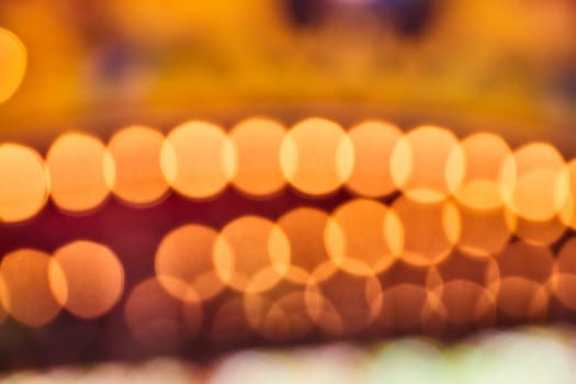 Golden bokeh lights shimmer, capturing the festive spirit of an evening at Fort Wayne Children's Zoo.