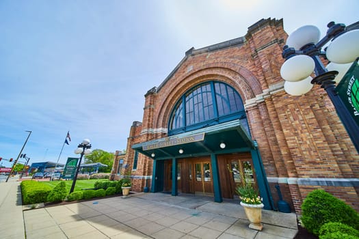 Historic Baker Street Station in Fort Wayne, Indiana, showcasing early 20th-century architecture and vibrant urban life.