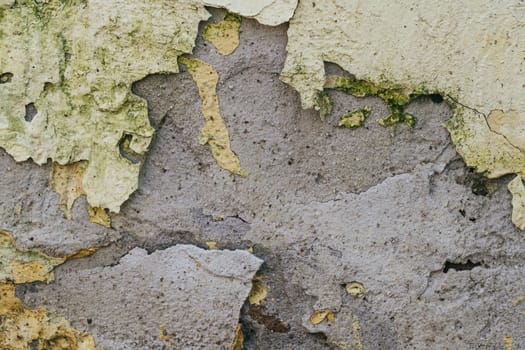 texture of old concrete wall with cracked paint close-up