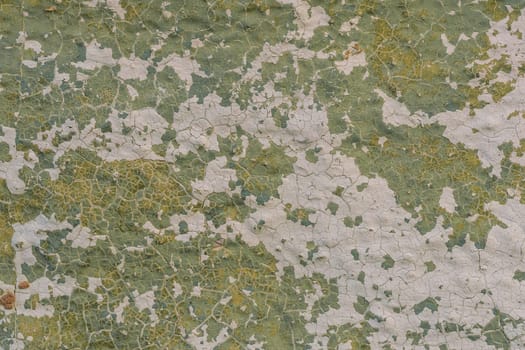 texture of old concrete wall with cracked paint close-up