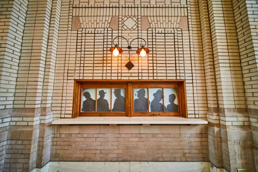 Vintage silhouettes on display in Baker Street Station, Fort Wayne, capturing historical elegance and heritage.