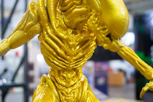 Art object printed on 3D printer. Detailed prototype model printed on 3D printer from molten plastic yellow gold color. Additive progressive 3D printing technology. New modern prototyping technologies