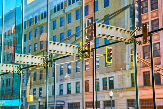 Modern meets historic in downtown Fort Wayne, capturing the dynamic interplay of glass architecture and classic city reflections.