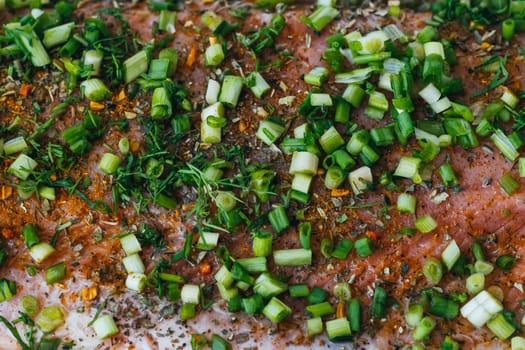 pink salmon meat with onions and Basil and spices