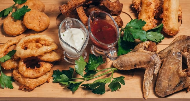 onion rings, crackers, chicken wings and other beer snacks