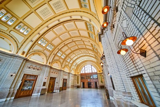 Elegant Baker Street Station interior featuring arched ceilings, ornate lights, and intricate tiles, Fort Wayne.