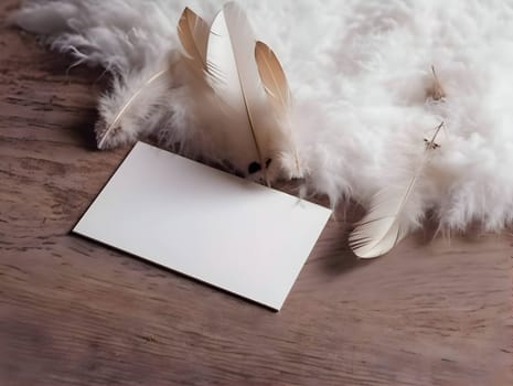 A white blank sheet of paper surrounded by fluffy white feathers.