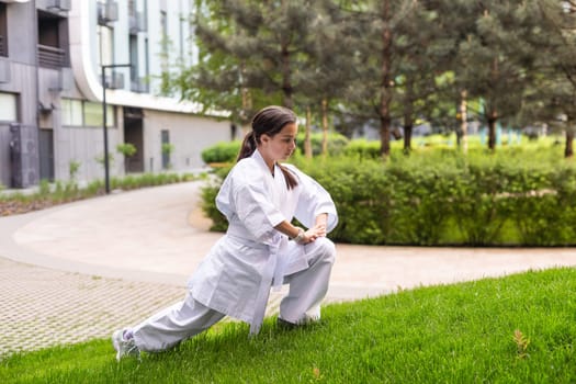 young girl in a white kimono, karate. High quality photo