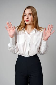 Young woman in a state of shock or surprise in studio