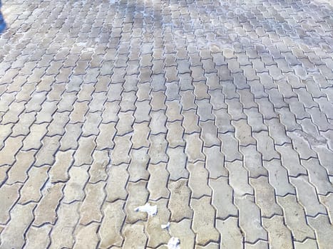 Worn tiles and snow on the ground. Background, texture, pattern, copy space