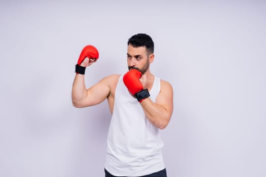 A man boxing with a red gloves on his hands. Professional fighter, boxer.