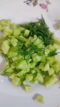 fresh green cucumber salad, eaten. High quality photo