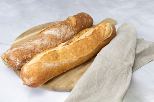 Freshly baked bread on a cutting board. High quality photo