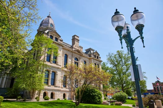 Spring day at Kosciusko County Courthouse, Indiana: Classic architecture under a clear blue sky.