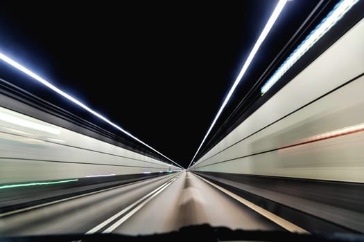 High-speed road tunnel view from a fast-moving car. Road and railway tunnel and blidge connecting Denmark and Sweden.