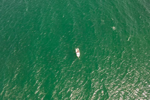 Aerial photo of small fishing boat in the Atlantic ocean.