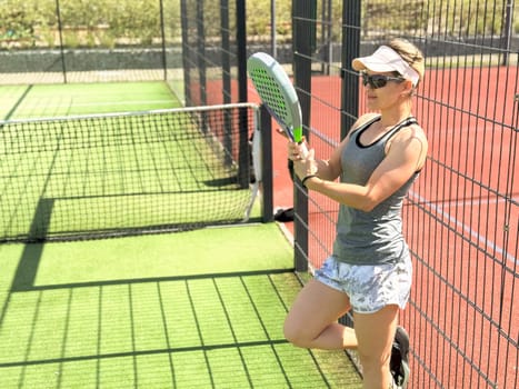Woman players serving ball. Young adult girl play tennis outside arena. Person racket beat game club. People group hit sport court match. Fit care free time. Run skill train. Padel tennis team workout. High quality FullHD footage