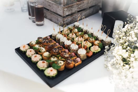 Small Canapes appetizers at the wedding