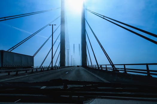 High-speed road bridge view from a fast-moving car. Road and railway blidge connecting Denmark and Sweden.