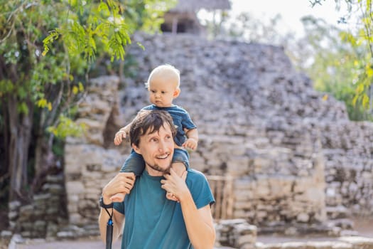 Dad and son tourists at Coba, Mexico. Ancient mayan city in Mexico. Coba is an archaeological area and a famous landmark of Yucatan Peninsula. Cloudy sky over a pyramid in Mexico.