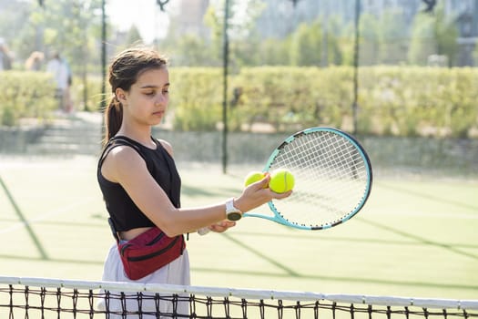 Young woman playing tennis on court. High quality photo
