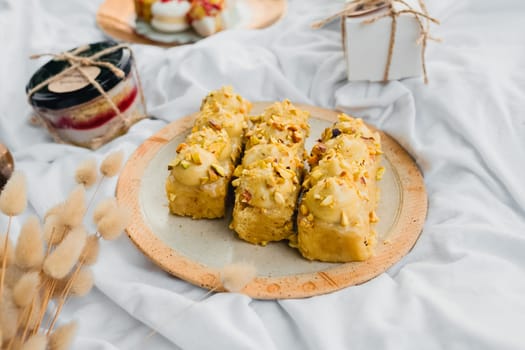 An array of delectable pastries resting on a soft, inviting bed, tempting anyone who catches a glimpse.