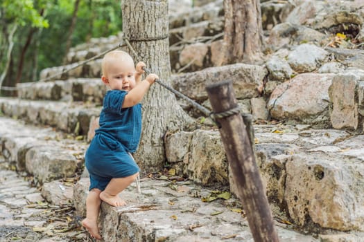 Baby tourist at Coba, Mexico. Ancient mayan city in Mexico. Coba is an archaeological area and a famous landmark of Yucatan Peninsula. Cloudy sky over a pyramid in Mexico.