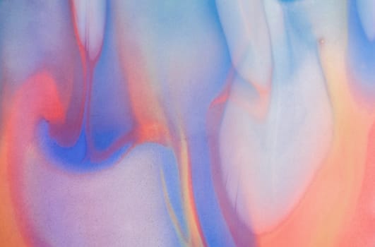 A fascinating combination of orange and blue shades of acrylic paint. Abstract background for websites, applications, invitations, business cards.