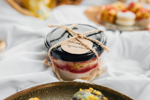 A lavish spread of delectable desserts, including cakes, pastries, and cookies, displayed on a pristine white tablecloth.