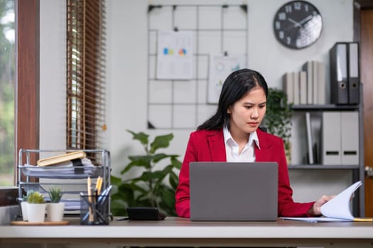 Young businesswoman has problems with her work in the office Feeling stressed and unhappy, showing a serious expression.