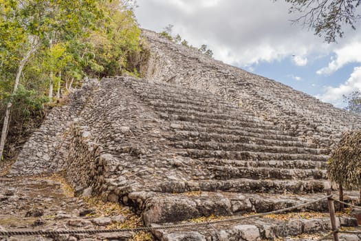 Coba, Mexico. Ancient mayan city in Mexico. Coba is an archaeological area and a famous landmark of Yucatan Peninsula. Cloudy sky over a pyramid in Mexico.