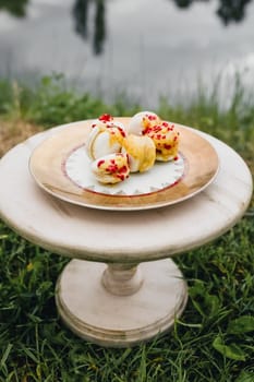 A delicious plate of dessert perched on a serene grassy hill, offering a tempting treat amidst natures beauty.