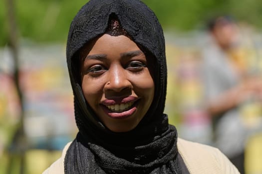 A Middle Eastern Muslim woman in a hijab beams with a radiant smile in a picturesque natural apiary, exuding joy and harmony