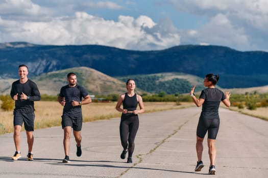 A professional athletic team as they train rigorously, running towards peak performance in preparation for an upcoming marathon.