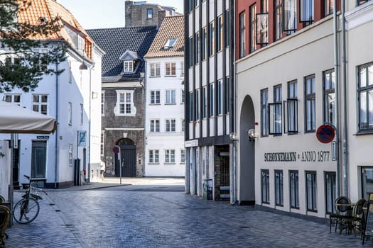 Downtown Copenhagen with old colored houses on a sunny day. Copenhagen, Denmark - September 30, 2023