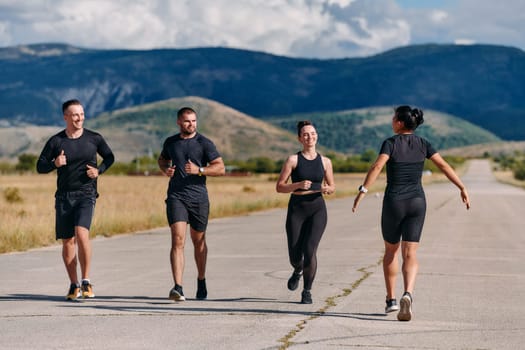 A professional athletic team as they train rigorously, running towards peak performance in preparation for an upcoming marathon.