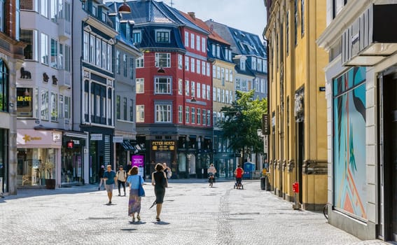 Downtown Copenhagen with old colored houses on a sunny day. Copenhagen, Denmark - September 30, 2023