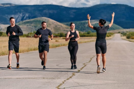 A professional athletic team as they train rigorously, running towards peak performance in preparation for an upcoming marathon.