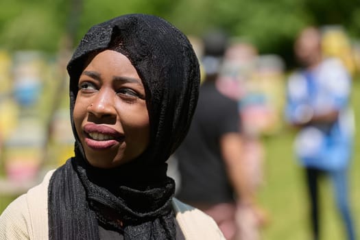 A Middle Eastern Muslim woman in a hijab beams with a radiant smile in a picturesque natural apiary, exuding joy and harmony