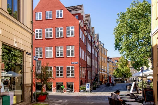 Downtown Copenhagen with old colored houses on a sunny day. Copenhagen, Denmark - September 30, 2023