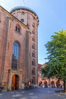 The Round Tower and Trinitatis Church in Copenhagen. Famous landmark in Copenhagen, Denmark - September 30, 2023.