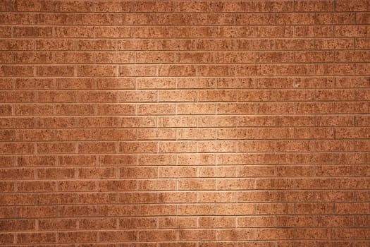 Warm, textured brick wall in downtown Fort Wayne, Indiana, perfect for architecture and design projects.