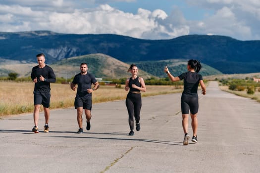 A professional athletic team as they train rigorously, running towards peak performance in preparation for an upcoming marathon.