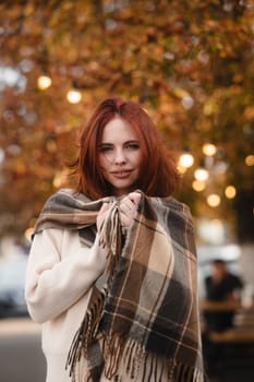 A dazzling redhead embracing the spirit of hippie culture on a sunny fall day. High quality photo