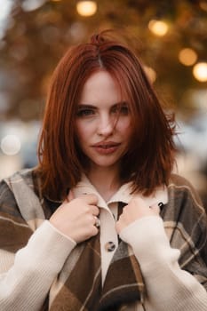 A vibrant ginger-haired girl channeling hippie vibes on a brisk fall afternoon. High quality photo